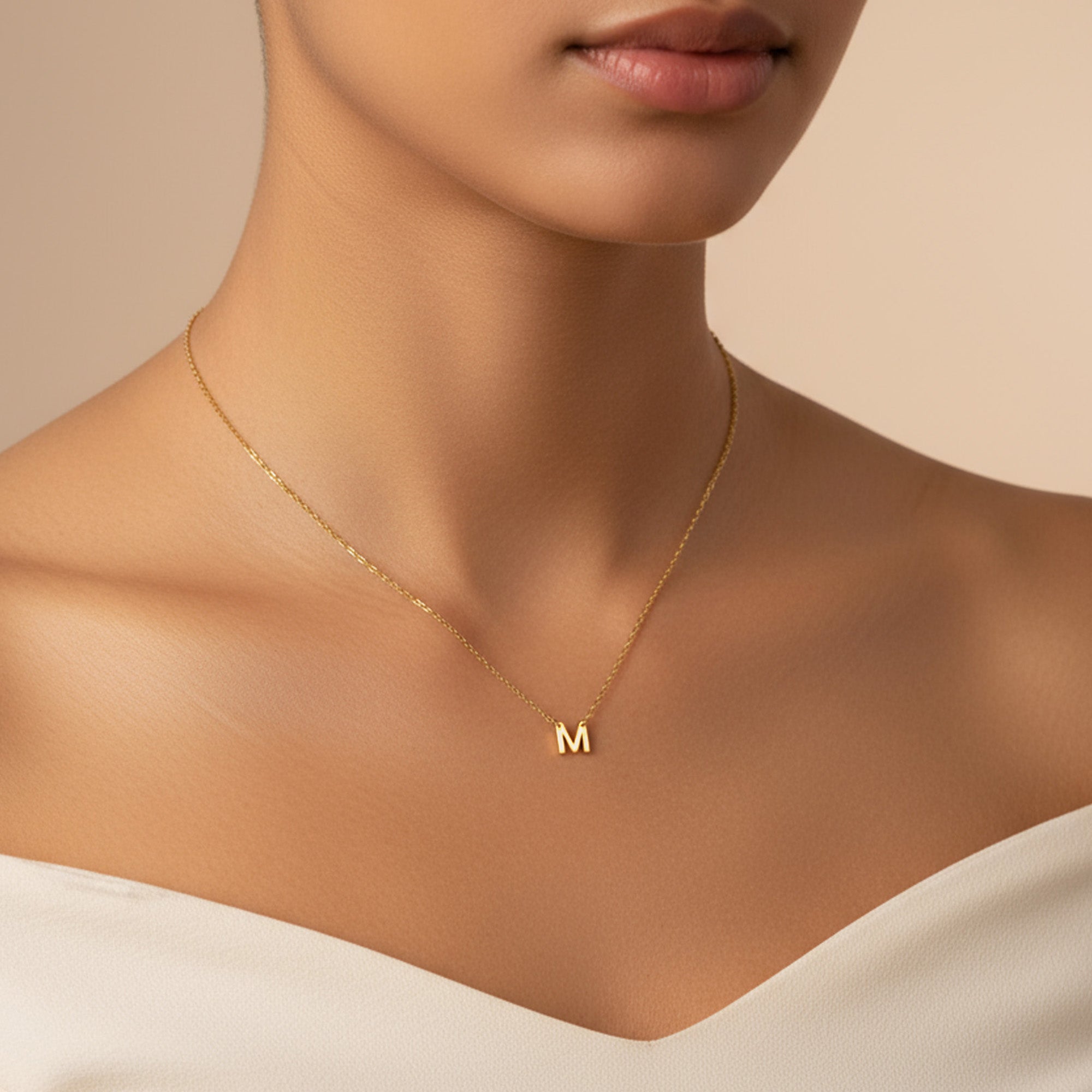 Gold dainty single initial necklace on model — minimalist letter pendant