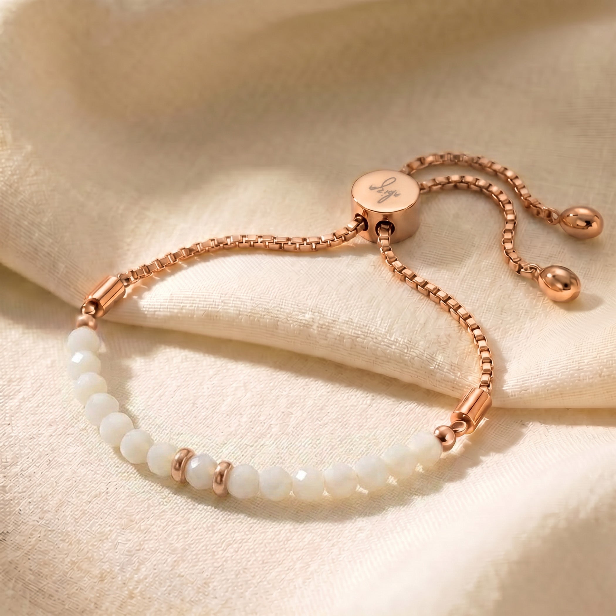Rose gold mother of pearl bracelet with iridescent white beads, adjustable slider chain